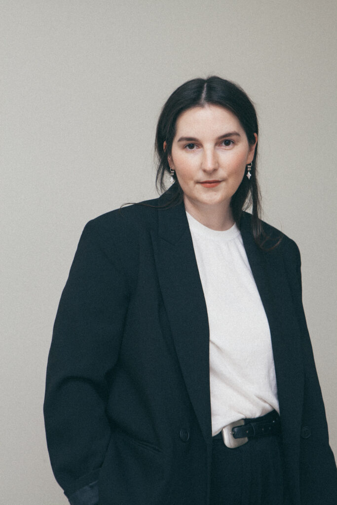 Person in oversized black blazer