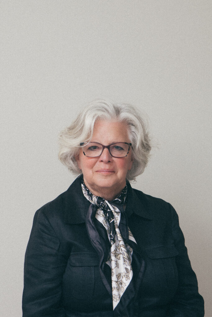 Woman with glasses and gray hair