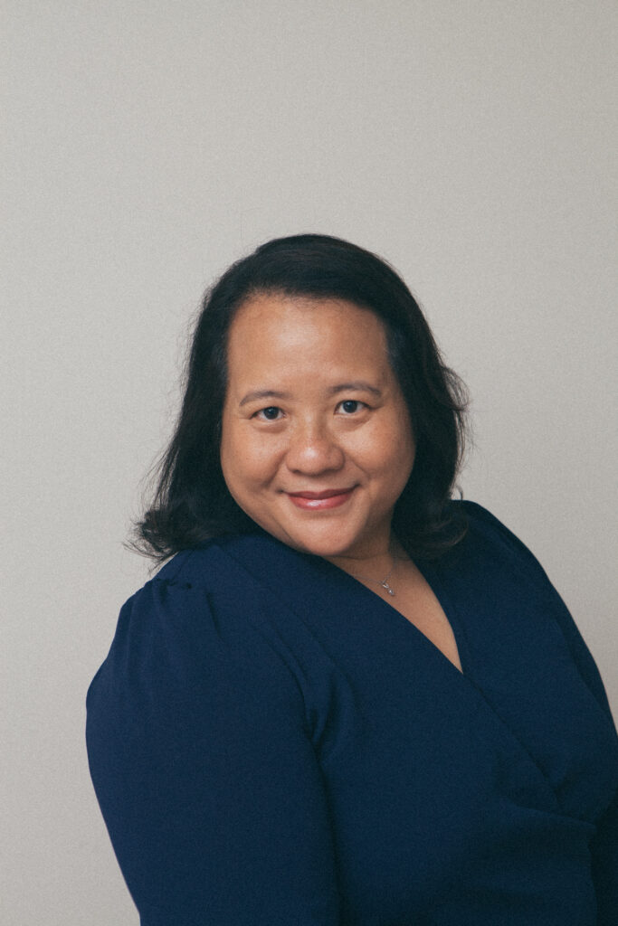 Smiling woman in blue attire