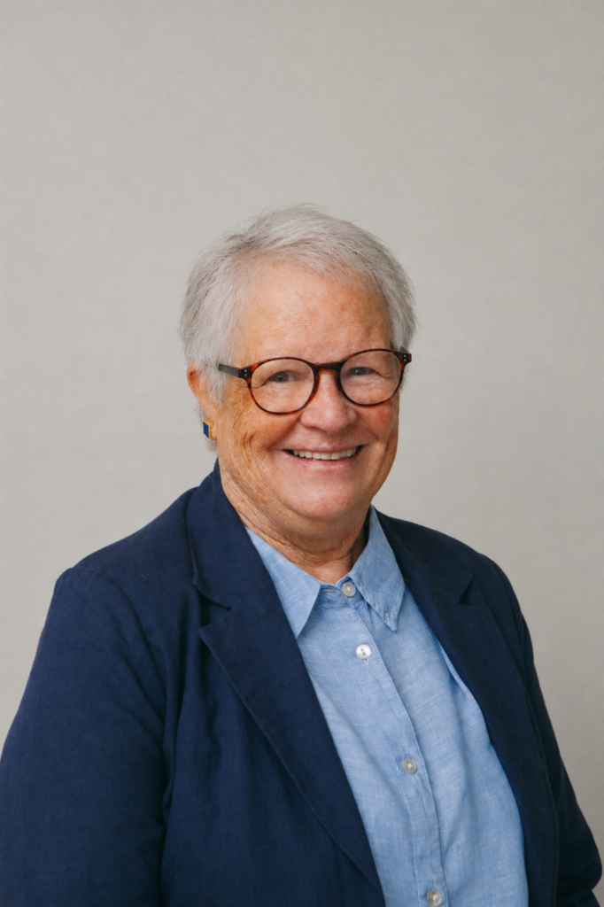 Smiling older woman in blue jacket