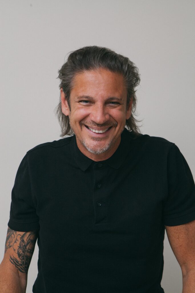 Smiling man with long hair